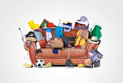 Professionals clearing furniture in a Feltham home