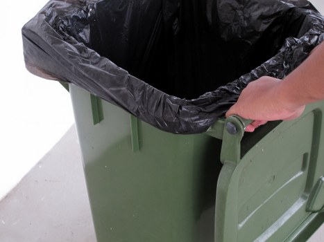 Construction site with professionals managing waste clearance